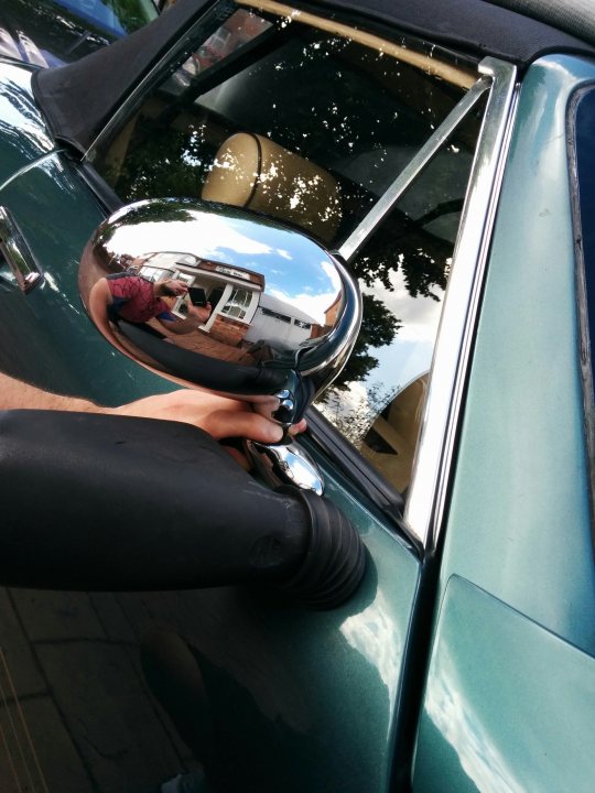 A man taking a picture of himself in a rear view mirror - Pistonheads