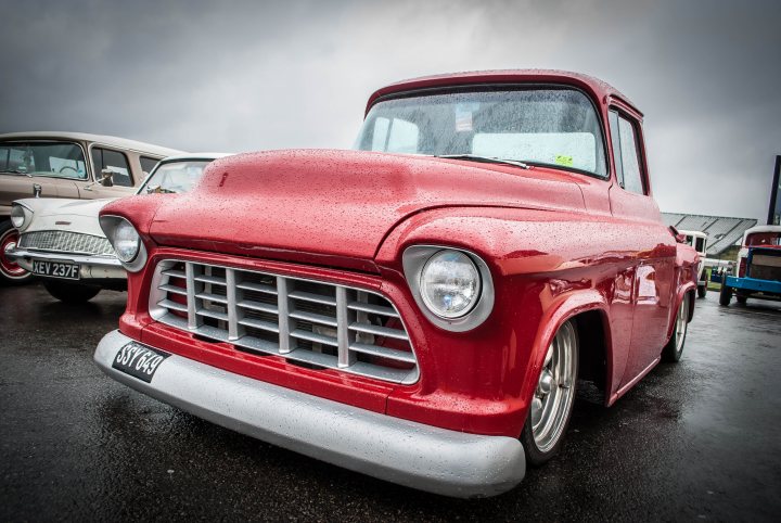 A red truck parked in a parking lot - Pistonheads