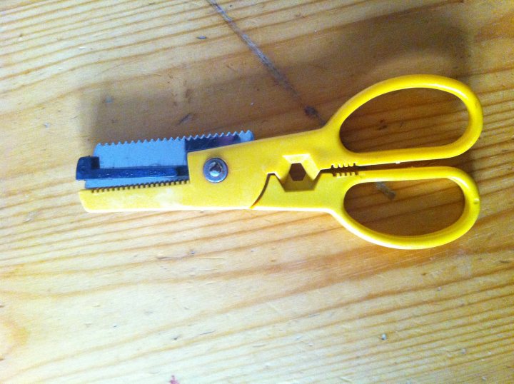 A pair of scissors sitting on top of a table