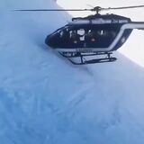 Picking up a passenger on a snow covered slope with a helicopter like a boss