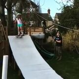 Dad built awesome ski slope and lift for his kids.