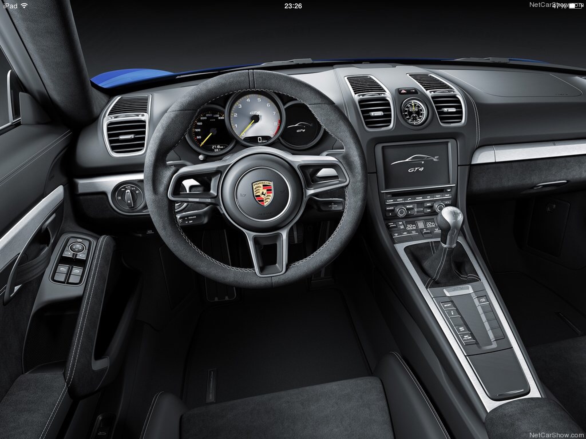 Prospective 981 GT4 Owners Discussion Forum. - Page 79 - Porsche General - PistonHeads - The image shows a luxurious car interior, featuring a driver's side perspective. The dashboard is sleek and modern, with visible air vents and control buttons. The steering wheel is at the center of the dashboard, marked with the Porsche logo. The automobile appears to be a high-end model with a minimalist design, emphasizing exclusivity and convenience. The ambient lighting inside the car enhances the high-tech and sophisticated atmosphere.