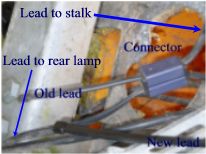 Strange wiring connector - Page 1 - Home Mechanics - PistonHeads - The image appears to be a microscopic cross-section view of an electronic component such as a display monitor or a lamp. The image is primarily composed of shades of gray, with a blue dashed line indicating a path of interest, possibly a pathway for electrons or data connectivity. Two additional labels are provided, "New Lead" on the top right and "Old Lead" on the bottom left, both connected to the center of the image, suggesting that this could be showing a design or manufacturing change. "Connector" is labeled on the top right, pointing to a specific part of the component, indicating where the new lead is being attached or substituted.