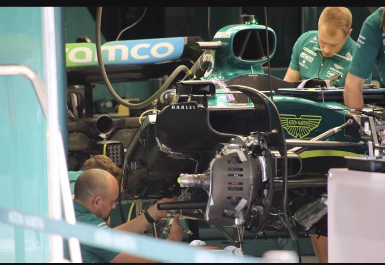 Official 2022 Spanish Grand Prix Thread ***SPOILERS*** - Page 6 - Formula 1 - PistonHeads UK - The image captures a dynamic scene from the pit lane of a Formula One race track. In the foreground, a mechanic in a green uniform is diligently working on the front of a vibrant blue and green Formula One car, which features a striking livery with a prominent logo. 

The car is being serviced at a stand with two mechanics attending to it. The focus of their attention is on the car's engine cover, suggesting they might be performing maintenance or inspection tasks before the start of the race. 

In the background, another mechanic in a matching uniform can be seen working on another car, further emphasizing the bustling activity typical of a Formula One race weekend. The cars and personnel are the main elements in this image, reflecting the intensity and precision required in such a high-stakes sport.