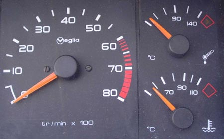 Gauge Pistonheads Issue Coolant - The image displays a complex dashboard featuring two distinct gauges, each showcasing a different parameter. The gauge on the left measures speed, which is marked up to 60 km/h, indicating the vehicle is not reaching high speeds. The gauge on the right is a round gauge measuring temperature, ascending from 30 to 140 degrees, suggesting a nominal operating range for the vehicle, with the current reading exhibiting a lower temperature.