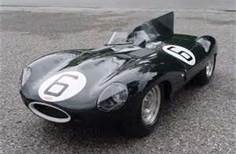 A black and white photo of a motorcycle - Pistonheads - This image showcases a single, sleek, black vintage car. It appears to be a coupe, indicated by the orientation of the vehicle where the doors are lined up along the top. The car has a prominent number 6 emblazoned on its side, perhaps indicating its racing number. This image provides a clear view of the vehicle's design and color, focusing on the front of the car, where the hood, grill, and the iconic Number 6 are visible. The car itself is stationary on a gravel road, adding to the vintage feel of the scene.