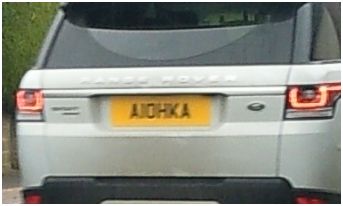 What C124PPY personalised plates have you seen recently? - Page 45 - General Gassing - PistonHeads - The image captures a silver car moving down a road. The most noticeable feature is the European-style license plate situated at the back of the vehicle. The license plate is yellow and has the registration "AAG 000". The car is caught in motion, with its left brake light on. There's no clear view into the vehicle, and the rest of the road and background are indistinct. The car appears to be a modern sedan, and the overall image gives a sense of everyday urban driving.