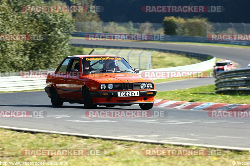 Your Best Trackday Action Photo Please - Page 86 - Track Days - PistonHeads - The image captures an exhilarating moment on a race track, where a driver in an orange and black race car is skillfully navigating a bend. The car is leaning into the turn, suggesting high speed. The number "52" is prominently displayed on the front of the car, indicating it's part of a competition. The background is a blur of greenery and the track's safety barriers, indicating the car is moving quickly and the focus is on the car and its swift motion.