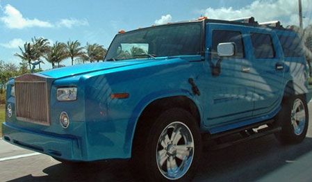 Phantom Pistonheads Spotted Suv - This image shows a vibrant blue sports utility vehicle (SUV) driving on the road. The SUV is stylishly designed with prominent features such as a large grille and angular headlights. It is a pickup truck and appears to have a lot of space in its truck bed. The truck is not just for function, but also showcases a luxurious finish with chrome accents that gleam under the sunlight. The vehicle is being filmed due to a watermark on the image, suggesting it may be part of an automobile review or a personal collection shared on social media.