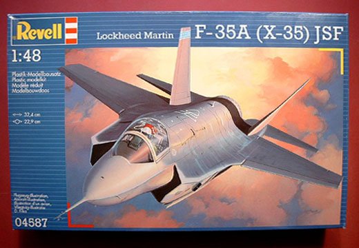 Looking for an F-35 Kit - Page 1 - Scale Models - PistonHeads - The image showcases a model kit, designed for an F-35A (X-35) lockheed martin jet fighter. The kit is displayed in its packaging, which is predominantly blue with the kit number "1:48" prominently displayed. The model depicts the jet fighter positioned in mid-air, allowing a clear view of its design and features, such as its pointed nose and aerodynamic body. There's a yellow ruler, indicating the scale of the model, which is 1:48, laid across the bottom of the image. The overall impression is of a detailed and realistic model that would appeal to model enthusiasts or those interested in military aviation.