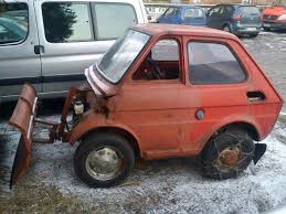 A red truck is parked on the side of the road - Pistonheads