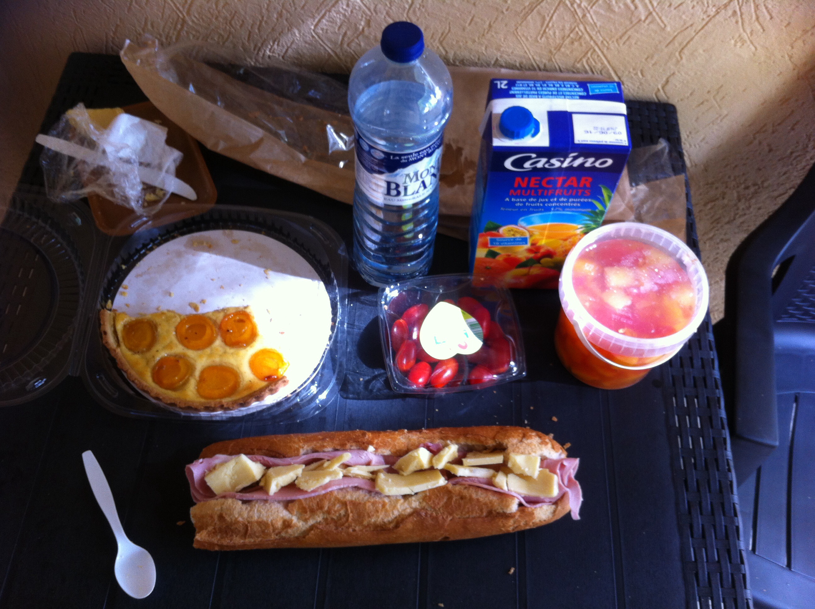 Pistonheads - The image shows a well-arranged picnic spread out on a table. There's a variety of foods and drink items, indicating a versatile and enjoyable meal. Firstly, there's a freshly baked orange cake, which is likely the main dessert choice. Next to the cake, there's a large Italian sub filled with deli meats and various condiments.

Besides the main course, there's a refreshing bottle of water, placed alongside another bottle of juice, which could be a citrus or fruit-flavored beverage. Additionally, there's a single cup and a bowl, which might be used for serving fruit or sauces.

In the background, there's a colorful pouch of chips, providing a crunchy side to the meal. Lastly, a plastic spoon is visible, suggesting the possibility of a cold salad being part of the spread. The entire scene suggests a relaxed and leisurely outdoor dining experience.