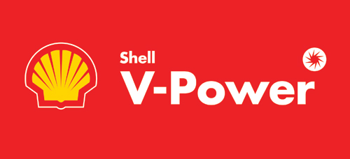 Warning Tesco Devon Pistonheads Petrol - The image has a red background. Prominently featured is the Shell logo, which consists of a yellow and white shell and the text "SHELL V-POWER" above it. To the right side of the logo, there is a smaller circular design, possibly associated with the brand but the image is not clear enough to discern its contents. The overall style of the image is indicative of commercial branding for advertisement purposes.