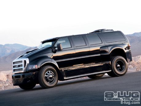 If you could, would you? - Page 1 - Yank Motors - PistonHeads - This image captures a sleek black Dodge Ram in action. The truck is navigating a winding road that cuts between hills, which provides a stunning backdrop to the vehicle. The sky overhead is a minimal blue, suggesting either dawn or dusk hours. There is a watermark or branding in the bottom right corner which includes the text "8OULG DIESEL TRUCKS 8LUG.COM".