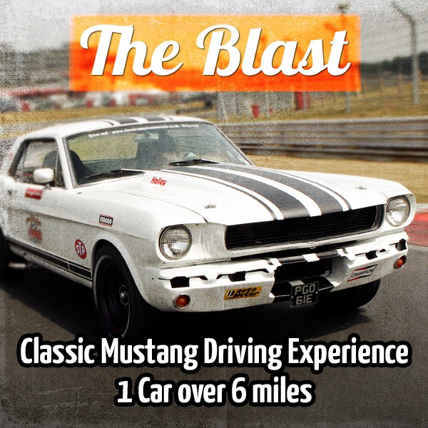 A car is parked on the side of the road - Pistonheads - The image features a classic white Mustang driving down a track, as indicated by the text which declares this is 'The Blast' - Classic Mustang Driving Experience. It appears to be a promotional or informative image, suggesting that the viewer can now book a classic Mustang driving experience for only $61, reduced from the original $500 price for regular booking. The style of the image is gritty and has a retro filter applied, adding to the classic vibe of the scene.