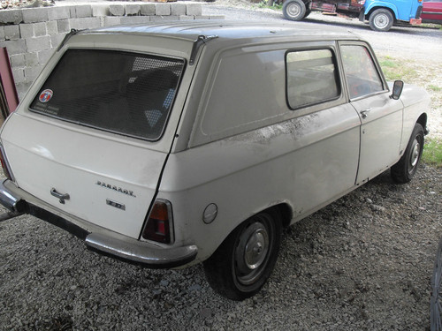 304 fourgon... - Page 1 - French Bred - PistonHeads - The image shows an elderly car parked on a gravel surface. The vehicle is a compact sedan with a distinct two-box design, featuring an upright front and compact rear. The car is predominantly white and appears to be of a vintage nature, suggesting it's likely several decades old. The side windows and moonroof give it a classic and timeless look. The emblems and badges on the car are not clearly visible. The engine compartment is partially obscured, and the mud fender in front looks slightly battered, indicating the car has seen better days.