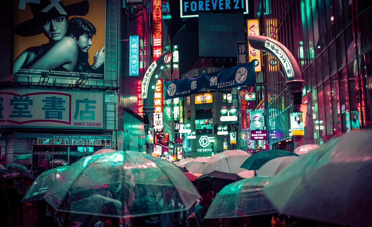 Free People Near Buildings during Nighttime With Lights Stock Photo