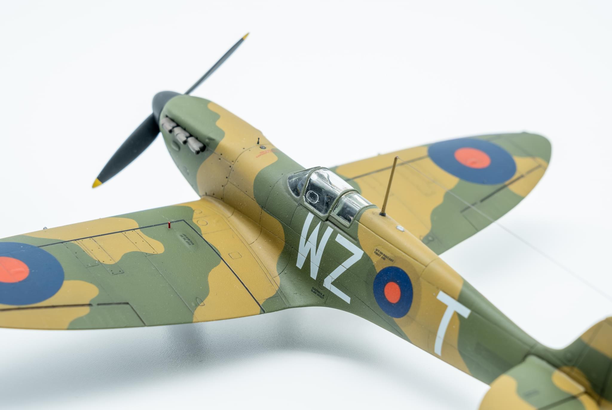 Pistonheads - The image showcases a vintage military plane, painted in an olive green color. It's a small model aircraft that carries the markings of the British army. The plane is adorned with the letters 'R' and 'F', along with a number on its side. A single propeller can be seen on the nose of the plane. This aircraft is a part of a collection, as indicated by a small display stand beneath it.