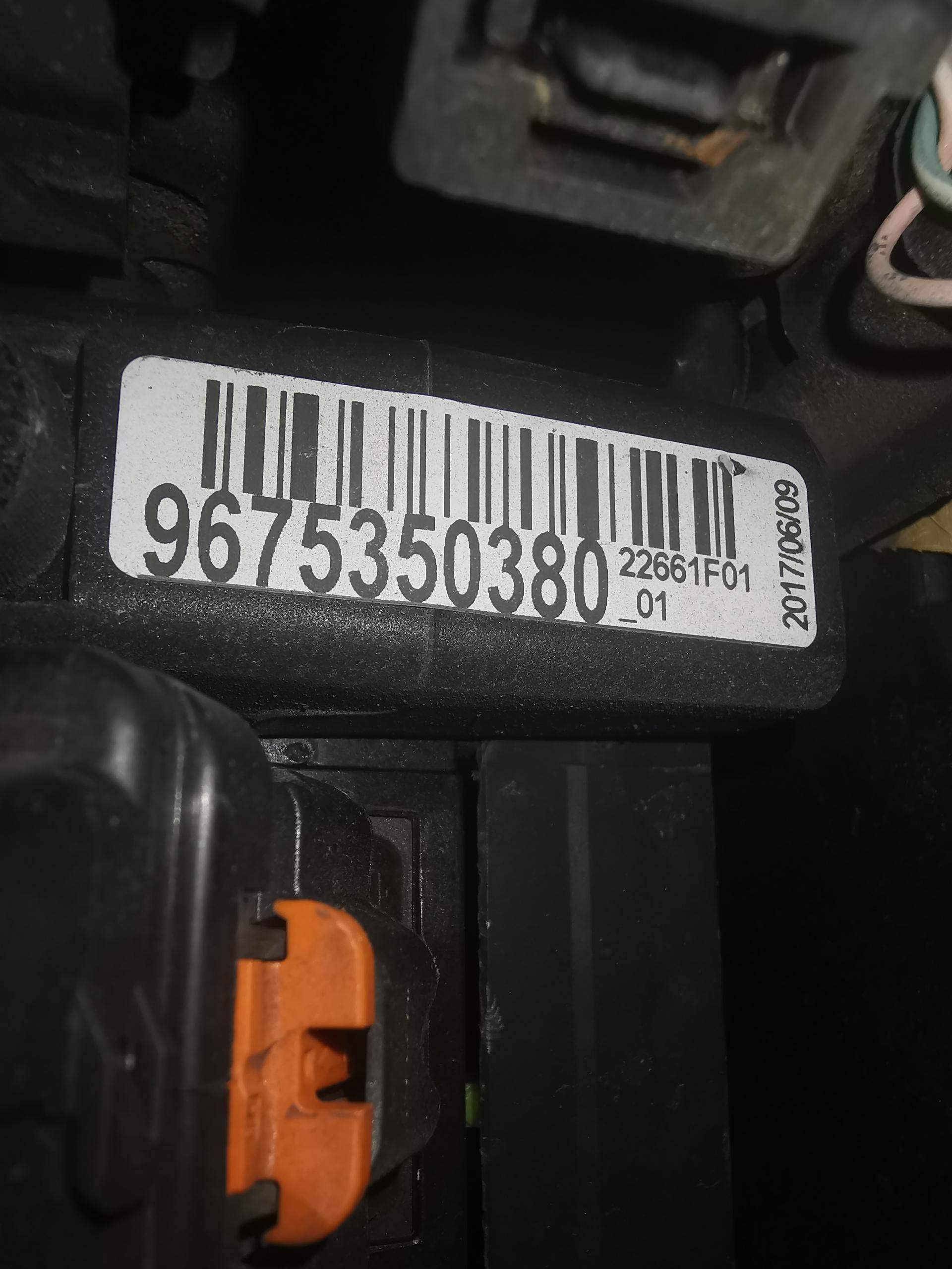 2017 Peugeot 3008 issues - Page 1 - French Bred - PistonHeads UK - The image is a photograph focusing on the back of an electronic device. There's a barcode with numbers beneath it, which is typically used for inventory and tracking purposes. This label includes the number 0197453086263, along with some other characters that are likely to be the product code or serial number. The style of the image appears to have been taken by a smartphone camera from a vertical angle, as suggested by the orientation of the device and the perspective of the shot.