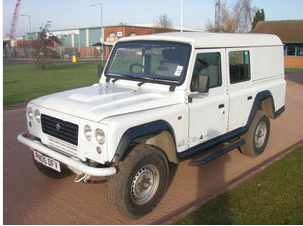 Best double cab pick up for £4 - 5K - Page 1 - General Gassing - PistonHeads - The image depicts a white classic Land Rover SUV on a brick paved area. The vehicle is parked and facing towards the left side of the image. It appears to be an old model, characterized by its rugged design and thick, black tires. The Land Rover brand name is prominently displayed on the front and side of the car. The setting suggests an outdoor space possibly in a residential area, but the image is a bit blurry, making it difficult to see other details in the background. The overall impression is one of nostalgia and vintage charm.