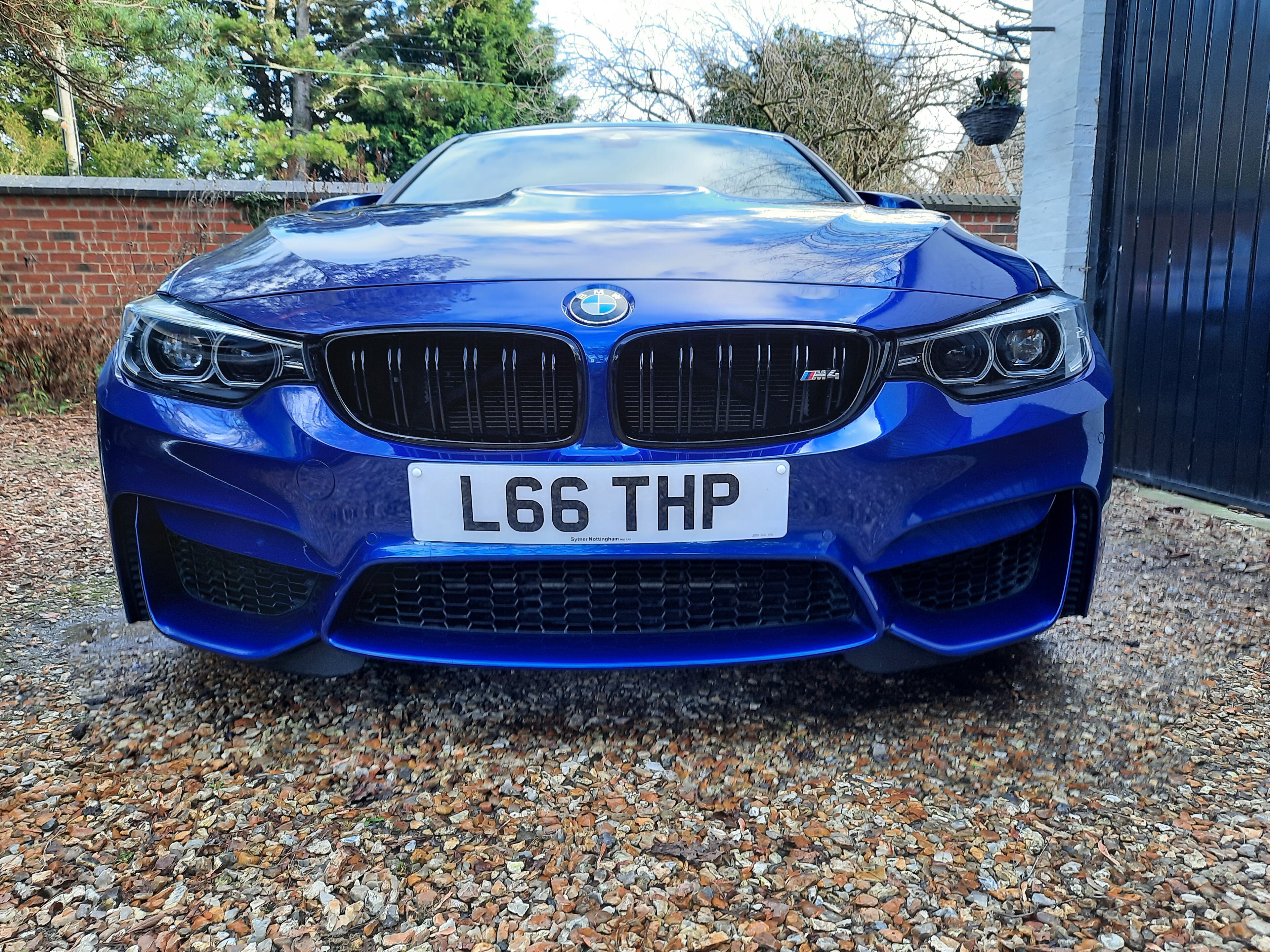 Our new to us 2015 F31 325D M Sport - Page 3 - Readers' Cars - PistonHeads UK - The image shows a blue BMW car parked in front of a building. The vehicle is positioned at an angle that showcases the front and side view, highlighting its sleek design and the distinctive Bimmer grill. It appears to be a well-maintained model with a polished exterior. The license plate on the car reads "L69 THP." There's no text overlaying the image; it is a clear, realistic photograph. The car and its immediate surroundings are the main focus of the image.