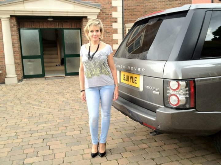 A woman standing next to a parking meter - Pistonheads