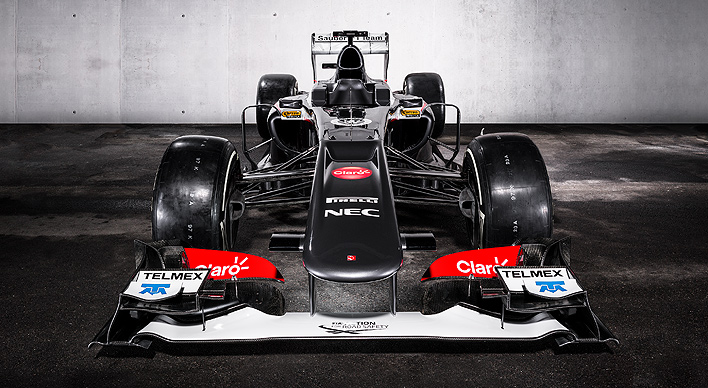 A motorcycle is parked in a parking lot - Pistonheads - The image displays a Formula 1 car on a dark background, positioned partially off the ground, possibly on a raised platform. The car is sleek and has a rear wing for downforce. It features pointy nosecones, wide sipes around the tires, and is predominantly black with red and white accents. The team logo is visible on the nose of the car, and the words "TELEMEX" and "CLAROTEL MEXICO" are prominently displayed.