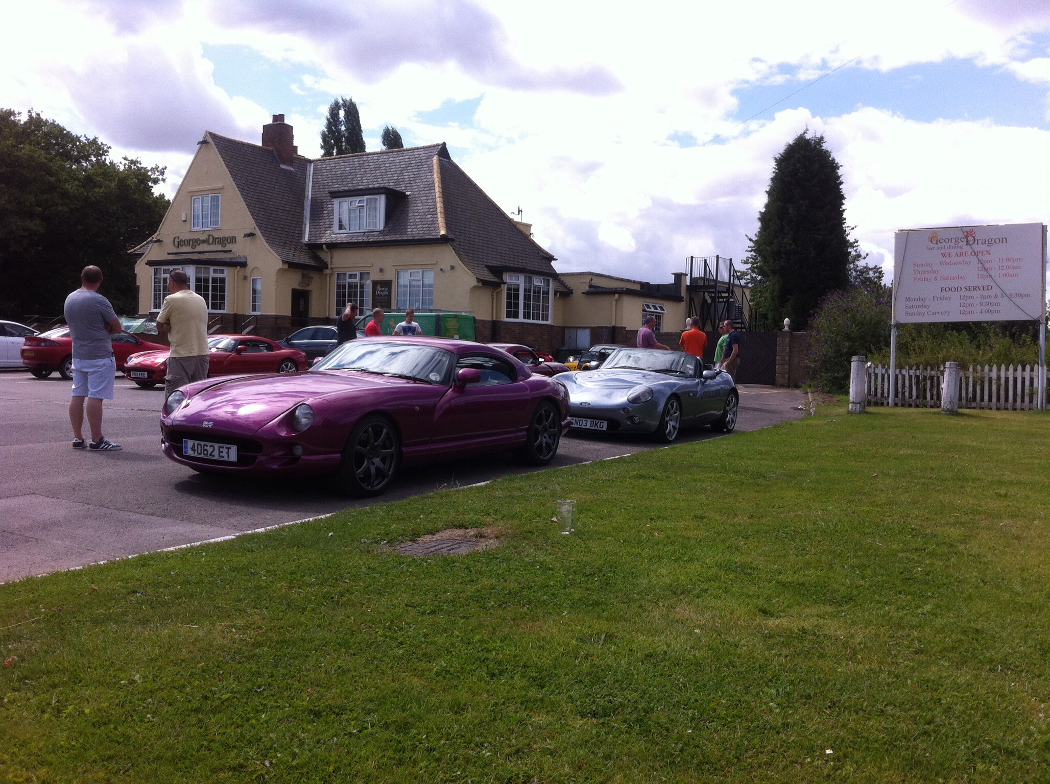 A red car parked in front of a house - Pistonheads