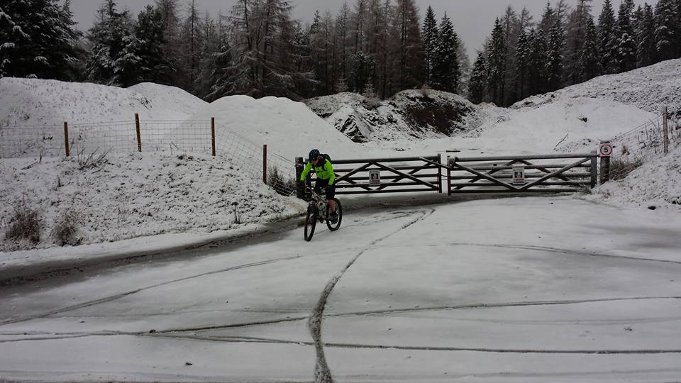 The "Photos From Today's Ride" thread... - Page 233 - Pedal Powered - PistonHeads - The image depicts a man riding a bicycle in winter. He appears to be handling a snowy path, as snow covers the ground and surrounds the trail, creating a rustic and wintry scene. The path curves gently into the distance, where the snow-covered landscape continues, albeit with less prominence of trees. The bicycle itself is obscured from view, suggesting the photo might be dominated by the surroundings. The cyclist is wearing winter clothing, prepared for the cold conditions. His lone figure conveys a sense of solitude and adventure, as he continues his journey in the midst of the snowy wilderness.