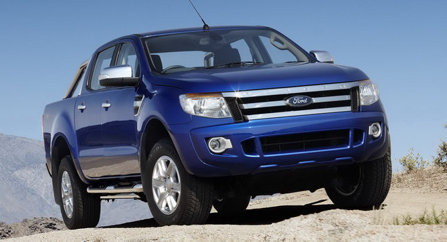 A truck parked on the side of a road - Pistonheads - The image features a blue Ford Ranger parked on a rocky surface. The vehicle is a modern SUV, characterized by its round headlights and the silver Ford grill. The truck is facing towards the left side of the image, suggesting it's ready for an off-road adventure. The backdrop is a clear sky and a vast rocky landscape, emphasizing the truck's rugged capabilities.