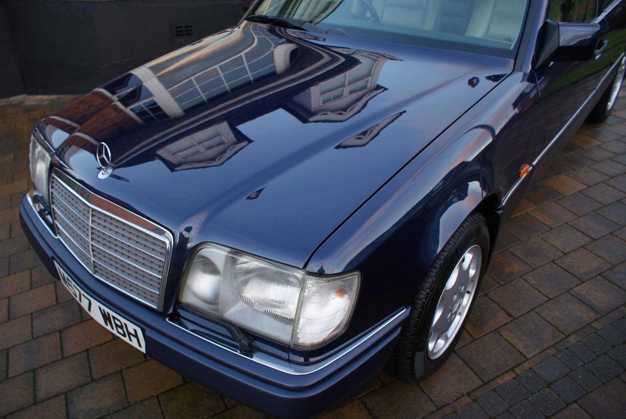 Best smoker barges 1-5 large [Vol 9] - Page 375 - General Gassing - PistonHeads - The image shows a glossy blue Mercedes-Benz, indicating that it might be a luxury vehicle. Its sleek black design contrasts with the blue exterior, which gleams in the sunlight. The vehicle is parked on a brick driveway, providing a moderately textured background to the image. The Mercedes-Benz logo is visible on the front of the vehicle, asserting the brand and model. The car's polished finish suggests it is a newer model or well-maintained.