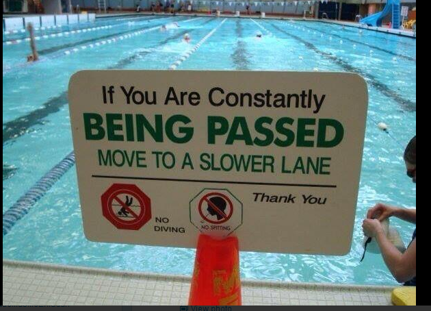 A red stop sign sitting on the side of a road - Pistonheads - The image is a photograph showing a sign posted near an indoor swimming pool. The sign has a customary message, stating: "If You Are Constantly Being Passed Move To A Slower Lane". The sign also includes a red circle with a line through it and a symbol of a diver, accompanied by the text "No Diving", and a rectangular symbol with the text "Thank You". In the background, there are swimming lanes and the pool's interior is partially visible. At the bottom right corner of the photo, part of a person's arm is seen, suggesting that someone is at the other end of the pool. The sign and the background provide an indication of a recreational or exercise swimming setting.