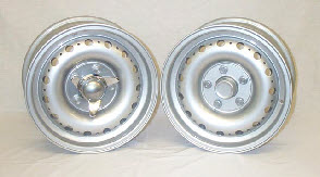 A close up of a cake on a table - Pistonheads - The image shows a pair of automotive wheels resting against a backdrop. Each wheel showcases a shiny metallic color, with a central hub and a textured appearance that resembles the spoke design. There is a clear sense of symmetry between the two wheels, suggesting that they are from the same vehicle. The wheels appear to be new or in excellent condition, with no visible signs of wear or damage. The overall style of the image is straightforward and product-focused, likely intended for showcasing or selling the wheels.