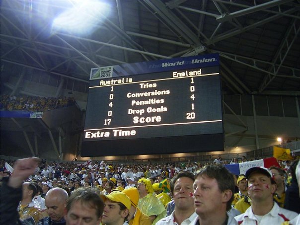 A large crowd of people walking down a street - Pistonheads - The image captures a lively scene in a stadium during an England vs Australia cricket match. The scoreboard prominently displays the ongoing score, with England at 1 wicket and 0 runs. The spectators, donned in various hues of outfits, add to the vibrant atmosphere, their attention riveted on the unfolding game. The setting is well-lit, a testament to the time of the match, which is right after the dinner break as indicated by the "Extra Time" text on the scoreboard.