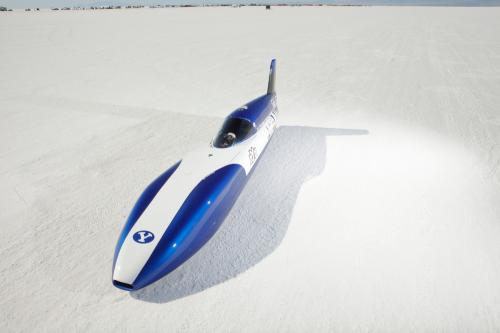 Electric car breaks 200 mph barrier! - Page 1 - EV and Alternative Fuels - PistonHeads - The image captures a lone, blue and white speed skate, designed for high-speed racing on ice. Located on snow-covered terrain, the skate's streamlined aerodynamics suggest it's built for efficiency and speed. Its blue and white color scheme adds a sense of dynamism to the scene. The stark contrast between the vibrant blue of the skate and the monochrome white snow creates a visually striking image.