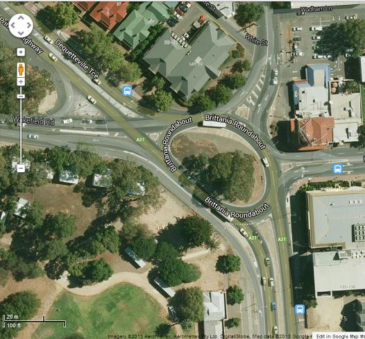 A picture of a bunch of flowers in a window - Pistonheads - The image displays an aerial satellite view of a road intersection within a suburban area. Various streets and roads radiate from the center, and there are a number of cars present on the roads. The image is an overlay on a base map, and it is marked with a street name, traffic speed, and a scale indicator. The view is from Google Maps and is centered on the intersection.