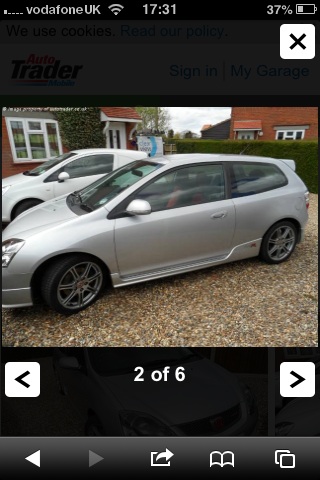 I want a CTR, what colour? - Page 1 - Honda - PistonHeads - The image shows a silver station wagon parked in a driveway. It appears to be taken with a smartphone, indicated by the user interface at the bottom of the image. On the phone, there's a button allowing the user to sign in to Autotrader's "My Garage" feature. The date and time on the phone's text overlay read "17:31". Additionally, there's a battery indicator and status at the top of the screen, which is common on many smartphones.