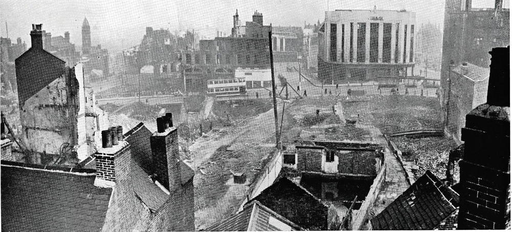 A black and white photo of a city street - Pistonheads - This black and white image is an aerial photograph of a small town from a high position. The town appears to have experienced significant destruction, as evidenced by the dilapidated and abandoned buildings scattered throughout the scene. The perspective offers a comprehensive view of the desolation, with skybridges jutting out from the heart of the town, creating a stark contrast. The image has a vintage quality, suggesting it might be from an older time period. The architectural style of the buildings hints at a past era, lending an air of nostalgia and tragedy to the scene. The colors are limited to shades of black and white, reinforcing the historical and despondent nature of the town.