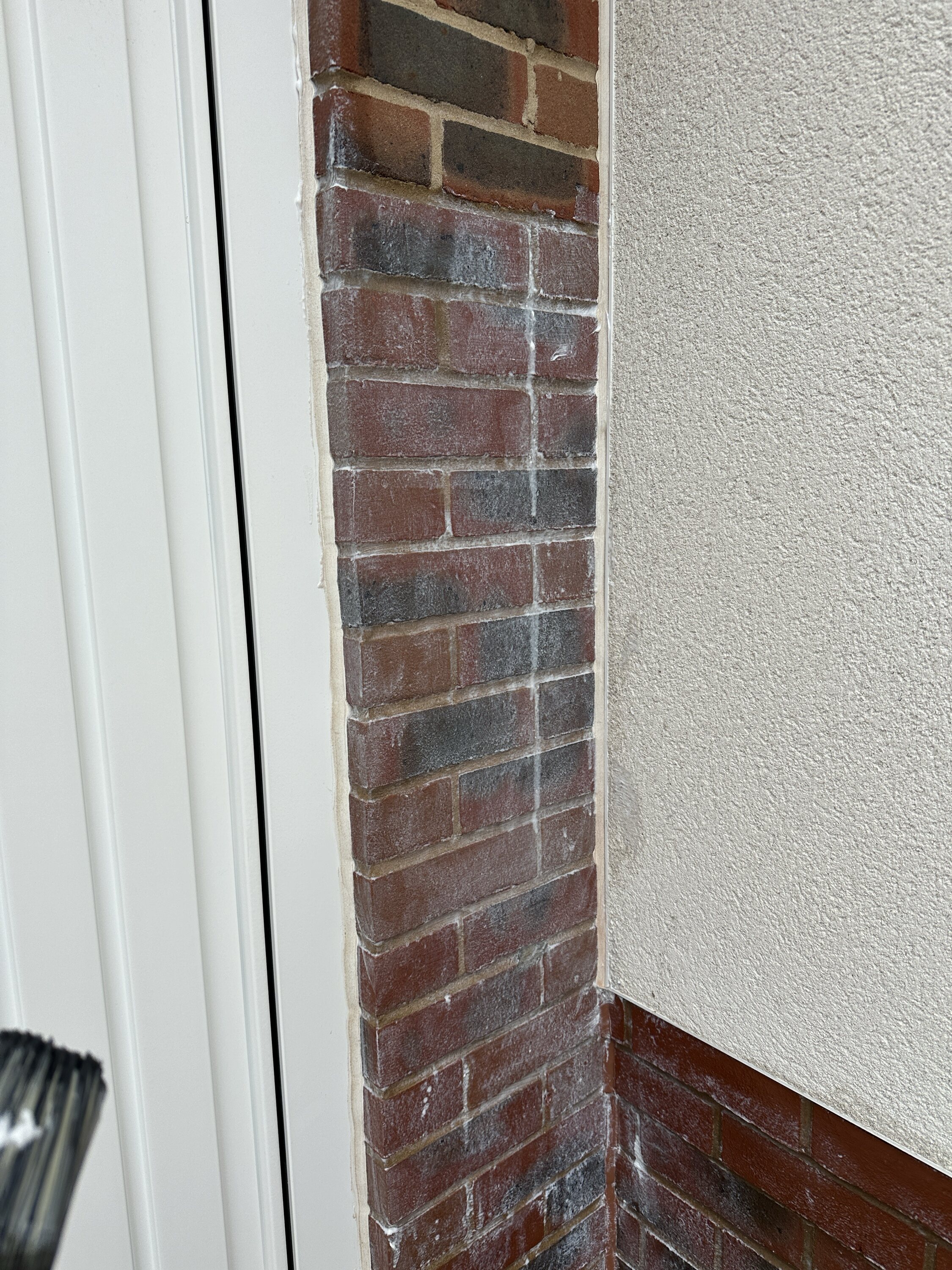 Pistonheads - The image shows a brick wall next to a white door. On the right side of the image, there is a paint stripper can on the ground, suggesting that the house is being painted or repainted. The top part of the brick wall appears to be in need of repair or maintenance. The wall and door frame the scene, creating a boundary between the interior space and the exterior environment. The paint stripper implies an ongoing process of home improvement or renovation.