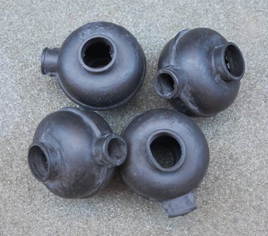 A bunch of old fire hydrants sitting on a sidewalk - Pistonheads - The image shows four black rubber grommets lying on a flat surface. The grommets appear to be made of a thick rubber material, and they have a round shape with a small central hole. The edges of the grommets are smoothed, and the surfaces have a matte finish. There is no visible text or branding on the grommets, and the background is neutral, making the grommets the focal point of the image. The style of the image is straightforward and product-focused, likely intended for catalog or online store purposes.