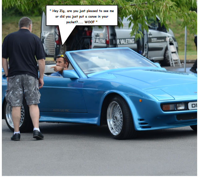 BBWF Wedge caption contest. - Page 1 - Wedges - PistonHeads - The image is a humorous snapshot of a moment where a man in patterned short-sleeved shorts is interacting with another man inside a blue sportscar. The car is parked in a lot with other vehicles behind it. The caption suggests that the man in shorts is engaging with the occupant of the car in a provocative manner, surprising the man inside the vehicle, who responds as if having been caught in the act of putting logs in his pocket. This playful disruption is set against a backdrop of an everyday scene, emphasizing the contrast between the mundane surroundings and the person's exaggerated behavior.