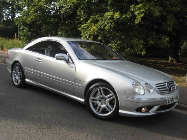 Pistonheads - The image shows a silver Mercedes-Benz A-Class parked on a paved road. It is an exterior shot with the car's profile facing the viewer. The vehicle is stationary, and there are no visible people or moving objects. The car has a sleek, modern design with a prominent grille and alloy wheels. In the background, there are trees and a clear sky, suggesting a calm and sunny day.