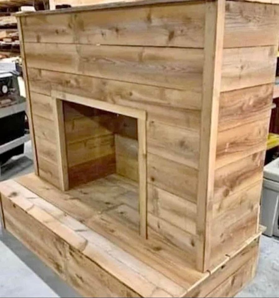 Facebook marketplace - Page 68 - The Lounge - PistonHeads UK - The image shows a wooden structure resembling an outdoor fireplace or barbecue grill. It has a flat, horizontal surface at the top that could serve as a counter or shelf, and a small opening in the middle that might be intended for placing logs or items inside. The structure appears to be made of wood planks, with visible joints where the boards meet.

The background suggests an indoor setting, possibly a workshop or a storage area, indicated by the presence of boxes and other items stacked against the wall. There's also a hint of machinery in the corner, suggesting that this location might be used for building or repairing such wooden structures. The image has been edited with text overlays that say "MADE OUT OF WOOD," indicating the material from which the structure is made.