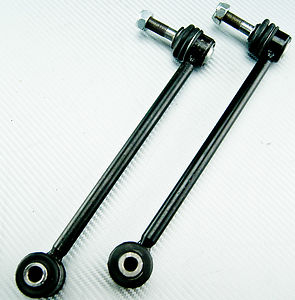 Peuugeot 406 rear drop link problem - The image shows two roller door hinges against a white background. They are black in color and appear to be of a similar design, suggesting that they are connected to each other and possibly a pair of doors. Each hinge has a bearing or pully at the bottom, likely made of plastic or a similar synthetic material, which is common in such door mechanisms. The pulleys are likely attached to a wire or rod that connects them to the doors. The image is a straightforward product shot, likely intended for a catalog or an online store, showcasing the items clearly for potential buyers.