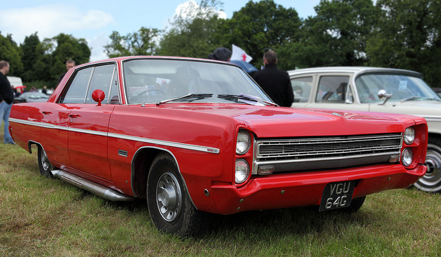 A red and white truck parked in a field - Pistonheads - The image portrays a vintage car show, featuring a stunning red vintage car on a grassy field. The mid-20th-century vehicle dominates the scene, highlighting its cutaway hood and chrome accents. A few other vintage cars are also visible in the background, silently speaking to the elegance of a bygone era of automotive design. In the distance, onlookers and possibly fellow enthusiasts can be seen, adding a sense of scale to this nostalgic tableau. The atmosphere is one of casual enjoyment, punctuated by the beauty and craftsmanship of classic cars.