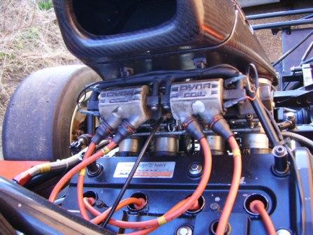 are these ht leads correct. supplied by radical?  - Page 1 - Radical - PistonHeads - The image captures the intricate workings of a powerful vehicle's engine, visible from the top direction. The engine's black and silver bulk is the central focus, contrasting with the vibrant orange of the car body. An abundance of engine wires, colored in vivid shades of red and yellow, snake their way across the scene, adding a sense of complexity to the view. The precise location of the connector on the engine indicates that the vehicle is well-maintained and cared for. The position of the tire in the upper part of the image suggests the engine's readiness for the dynamic power it bestows upon its host vehicle.