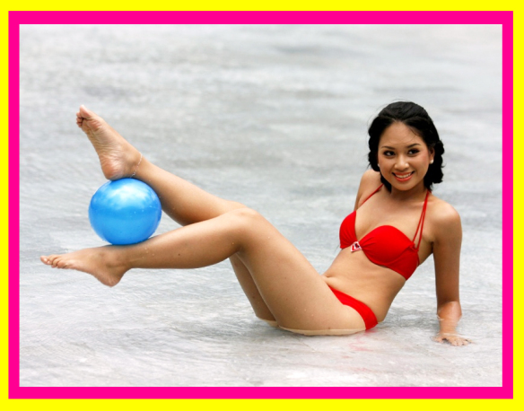 A woman in a bikini standing on a beach