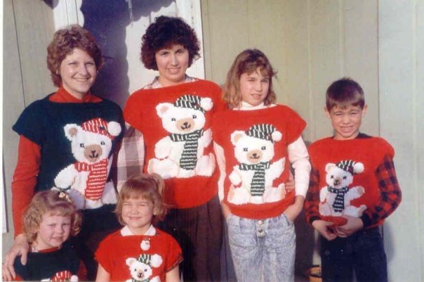 a bit council - Page 157 - The Lounge - PistonHeads - The image shows a family of six, consisting of a woman and five children, each wearing similarly themed, Christmas-related teddy bear sweaters. The woman stands next to three children in front of her, with another child standing a bit to her left and the last child on the far right. They are all positioned indoors with a noticeable contrast between the light and dark color of their sweaters.