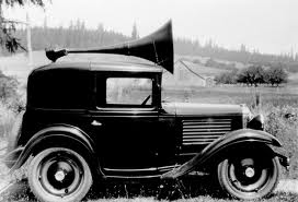 *******The OFFICIAL Spanish Grand Prix thread******** - Page 1 - Formula 1 - PistonHeads - The image is a vintage photograph of a classic black Model T car. The car is styled with early 20th century design features, such as a large, round horn on the back and a distinctive angular front bumper. The car is positioned on a gravel road near the woods, adding to the nostalgic ambiance of the image. The photo has a faded and aged appearance, contributing to its overall historical and artistic quality. The image captures the essence of early automotive history, showcasing the design and form of transportation from that era.