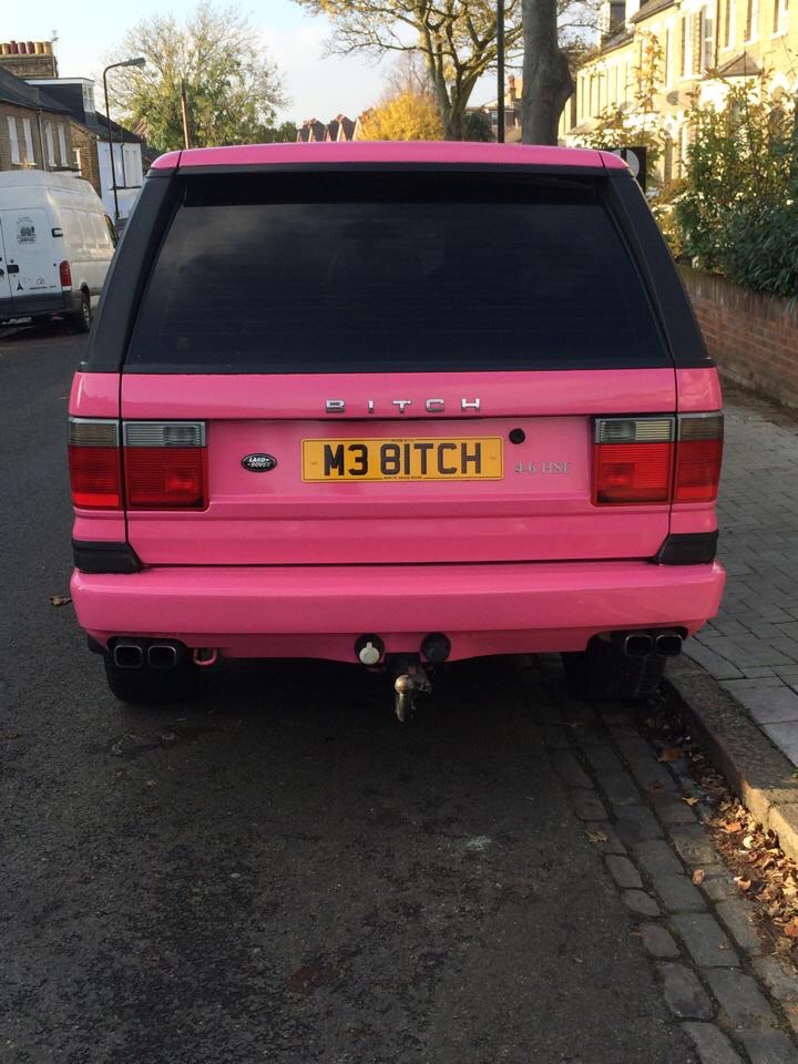 What crappy personalised plates have you seen recently? - Page 358 - General Gassing - PistonHeads - The image shows the back of a white Ford Ranger pickup truck parked in front of a house. The Ford logo is prominently displayed on the back of the vehicle, and the license plate reads "M3 BITCH." The truck's rear bumper also features a silver bumper sticker. The vehicle is parked on a brick driveway adjacent to a grassy area. The truck has a colorful tint on its rear window and taillights. The scene indicates a residential area.